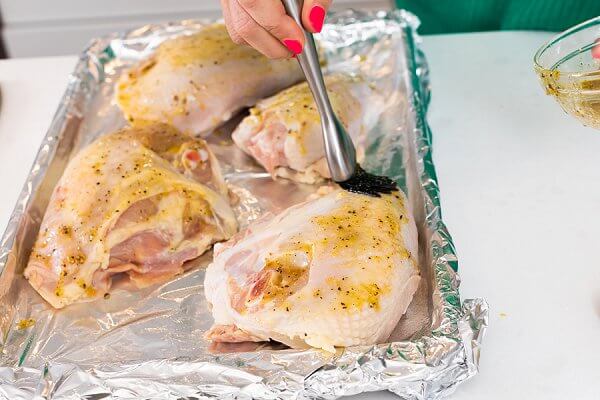 Liz Brushing Lemon on Chicken