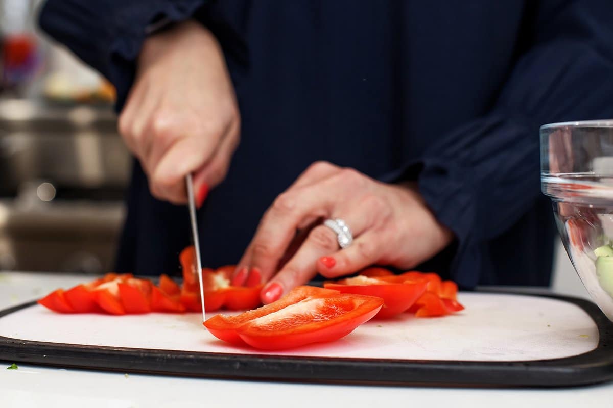 Liz chopping red peppers