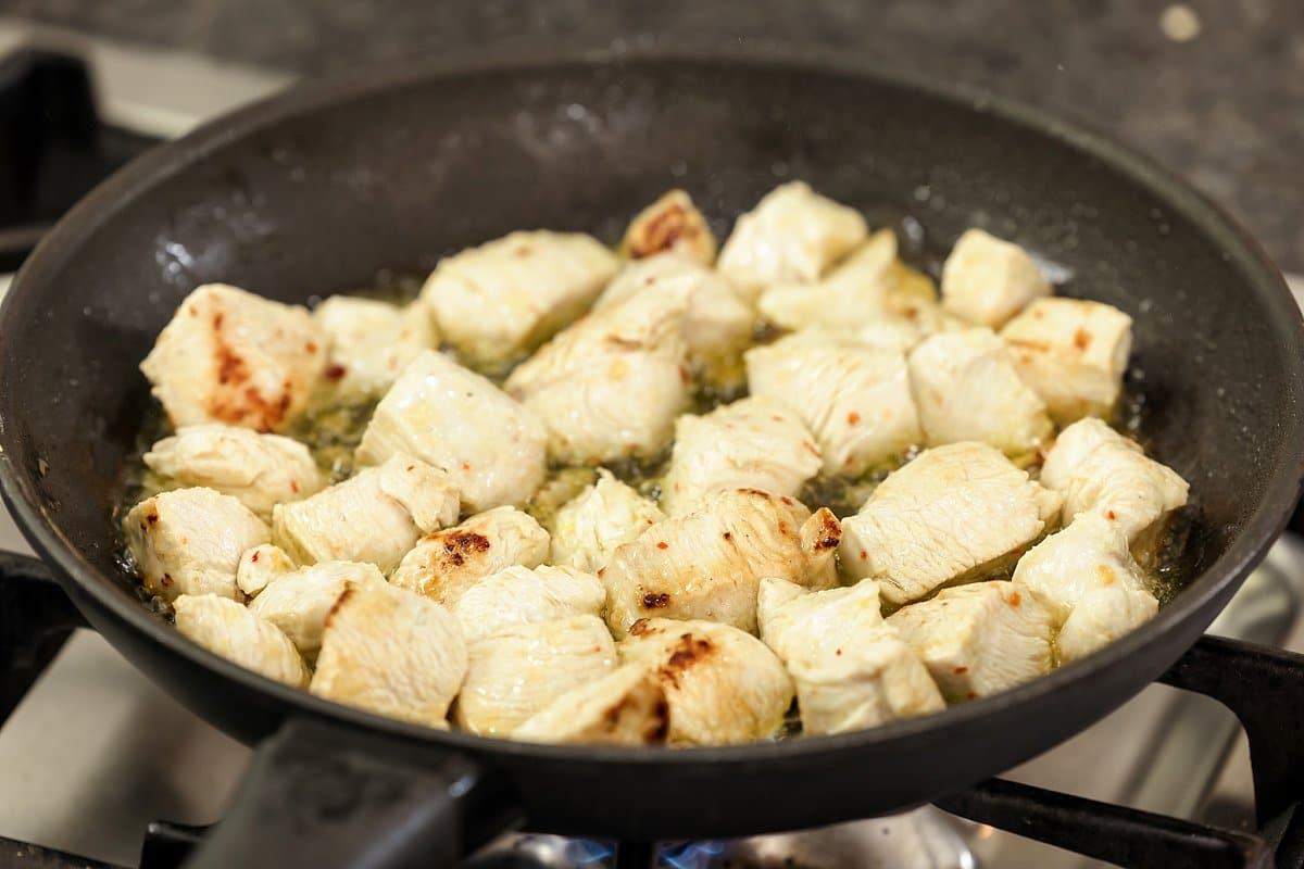 Sauteeing Chicken Tawook in a pan