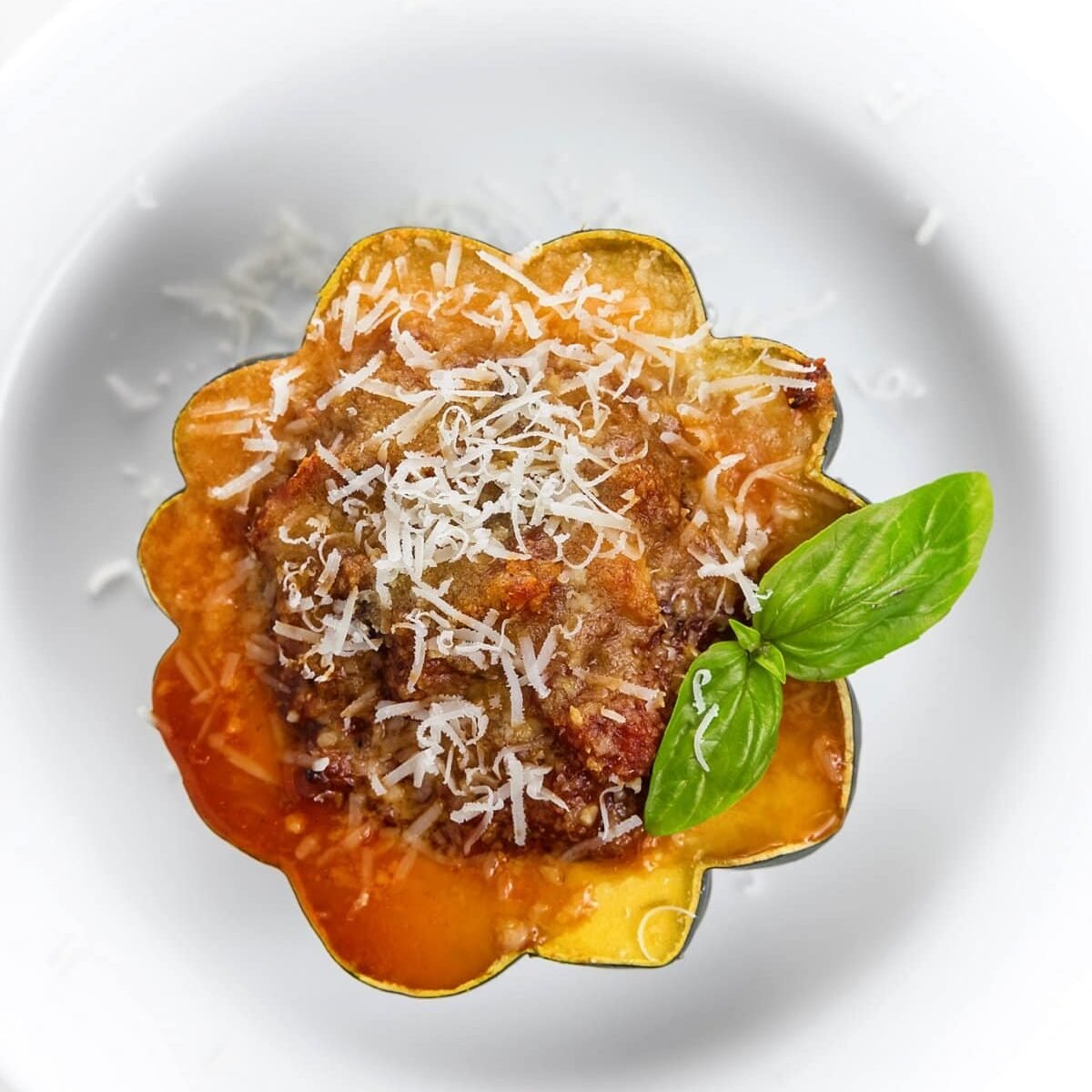 A plate of a cut open acorn squash