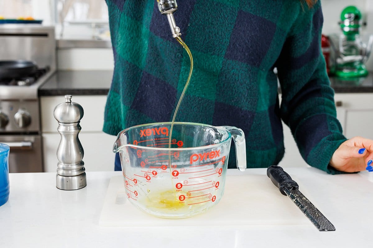 Adding olive oil to bowl 1