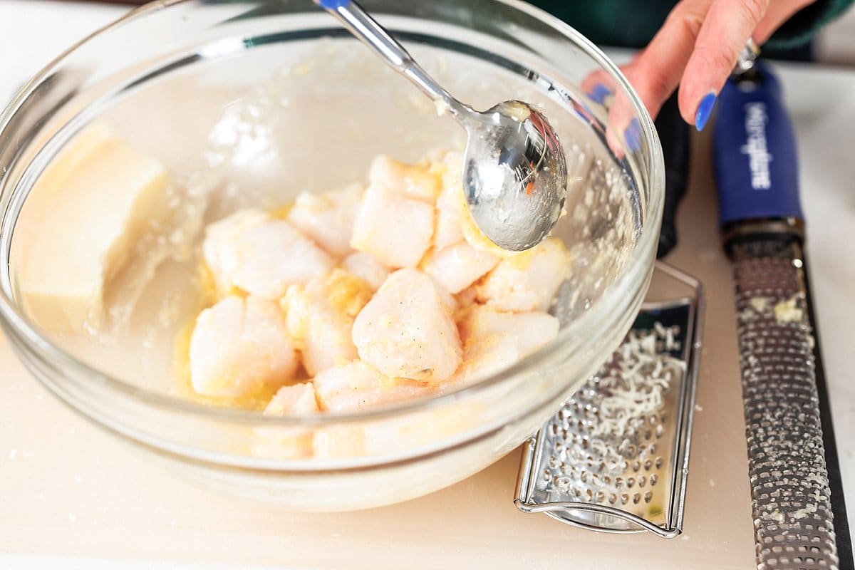 Stirring scallops in butter