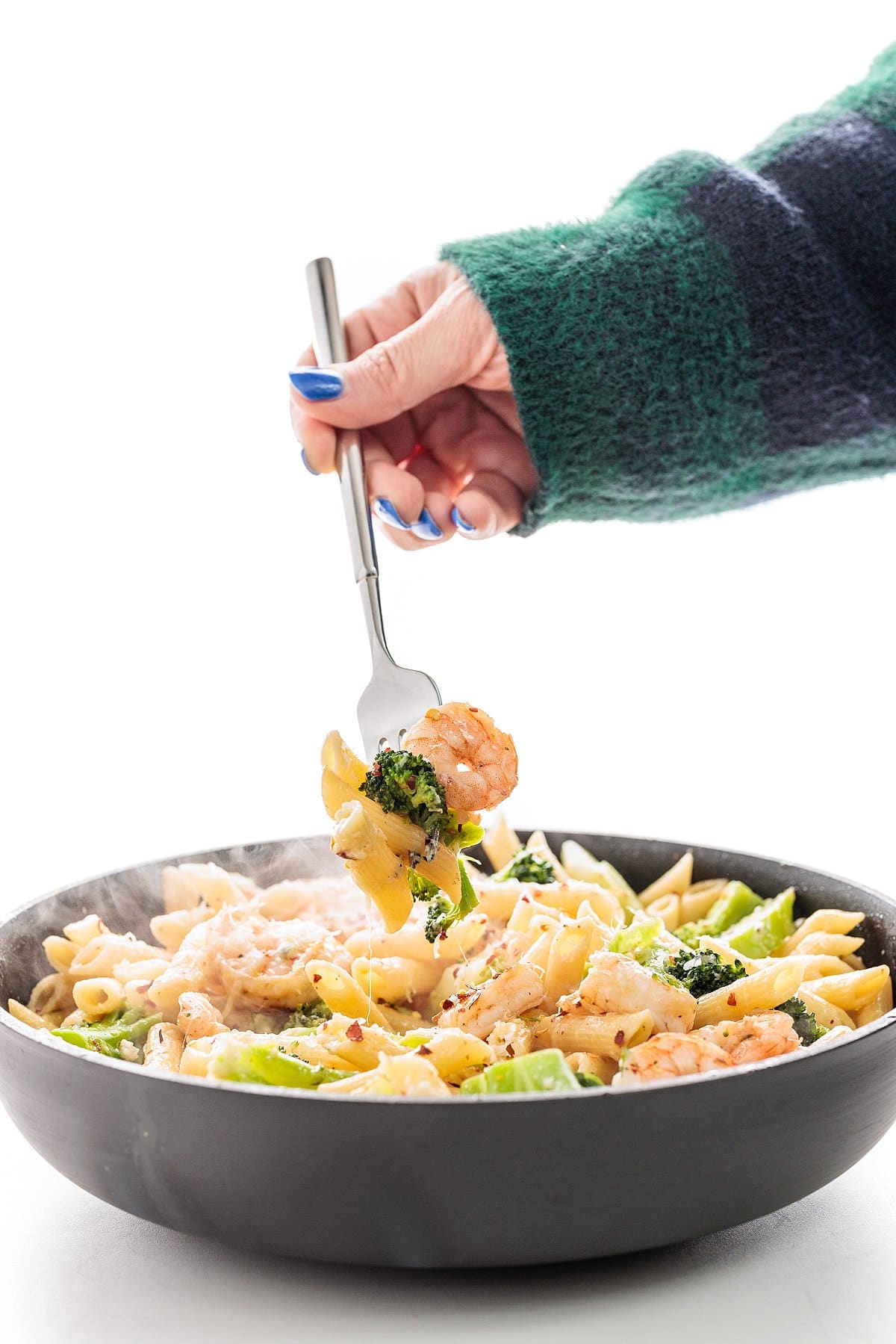 Forkful of shrimp and broccoli penne.