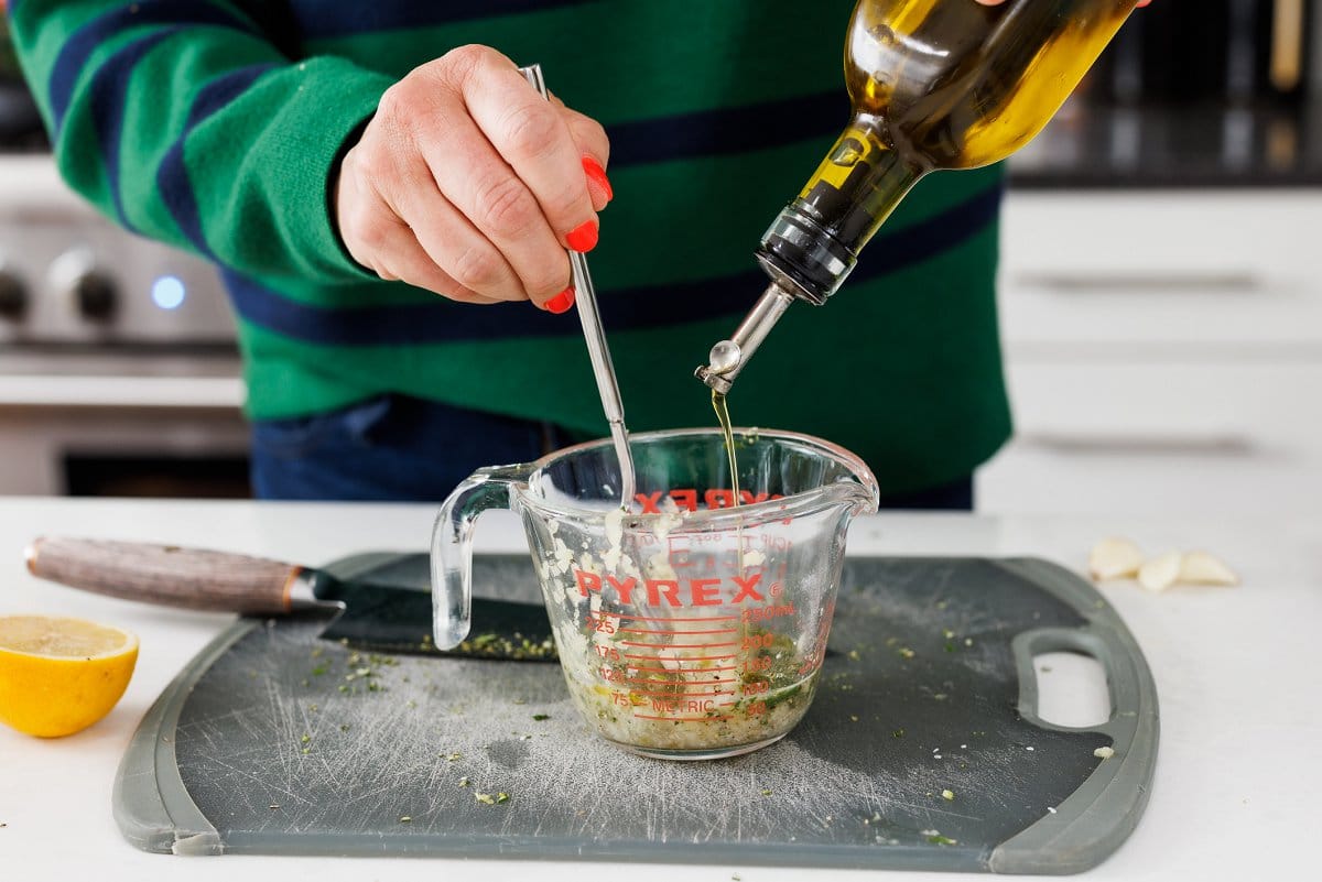 Adding olive oil to marinade