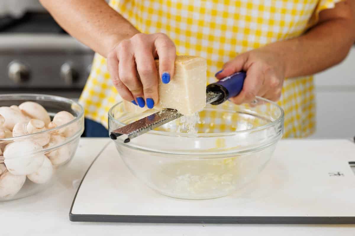 Freshly grating parmesan cheese