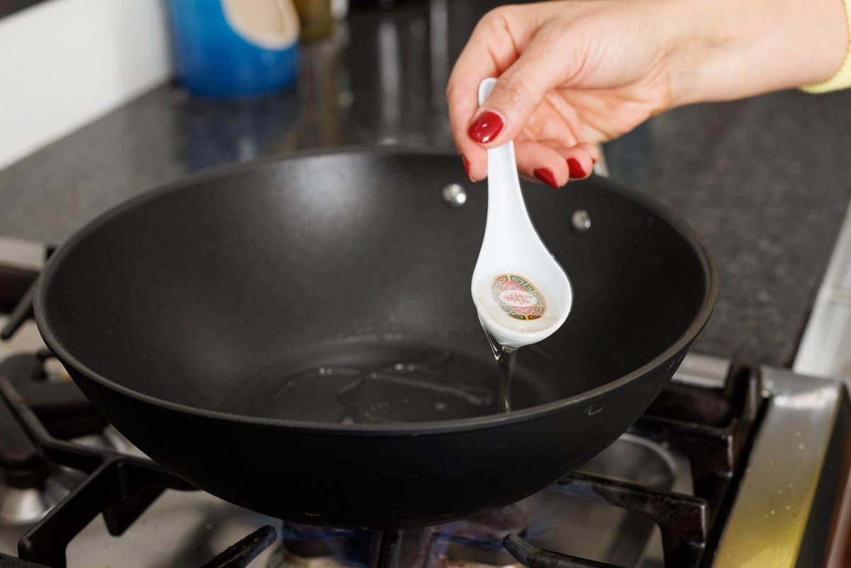 Adding oil to pan