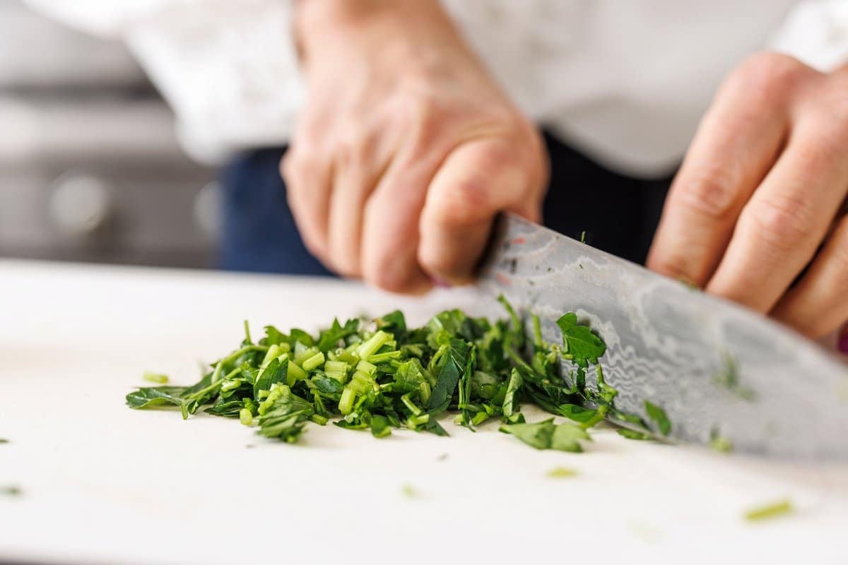 Liz chopping fresh parsley for tuna and white bean salad.