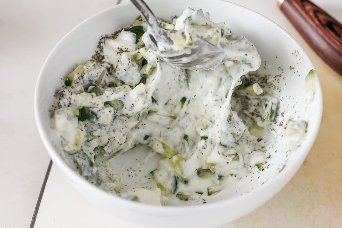 Stirring cucumber yogurt sauce