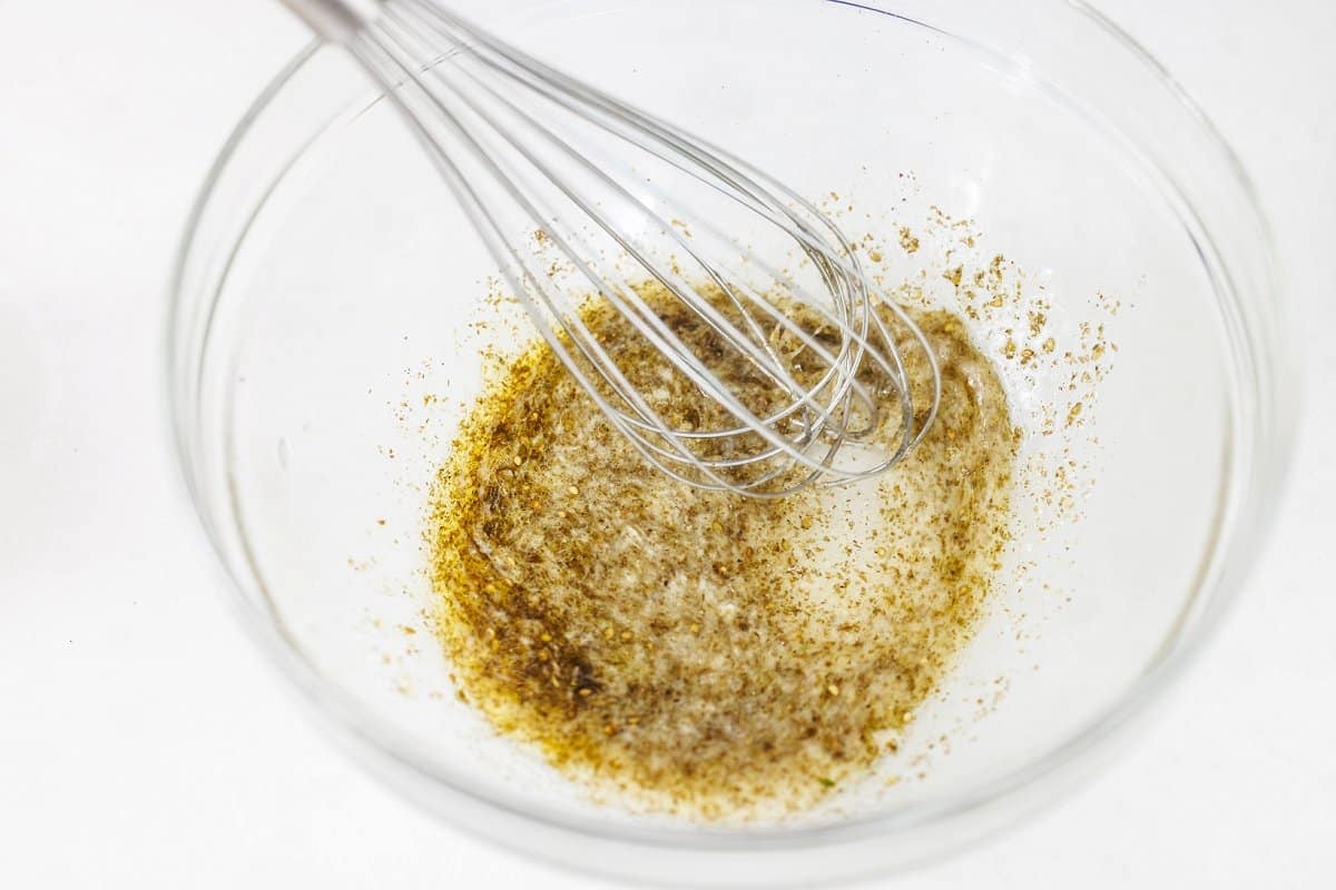 Whisking zaatar marinade