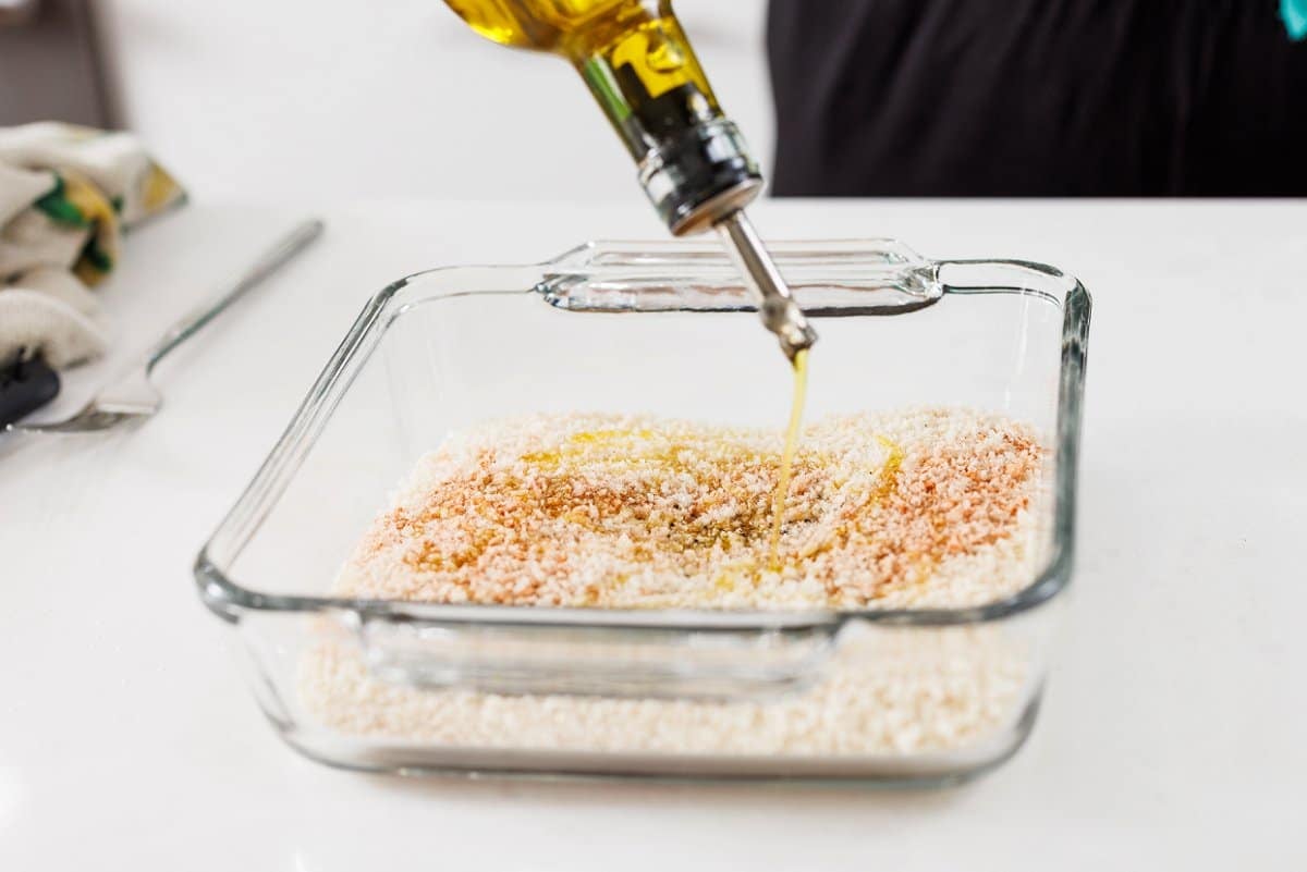 Drizzling olive oil in panko