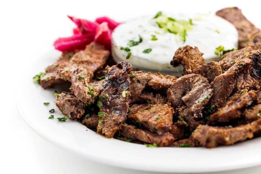 a plate of meat and sauce