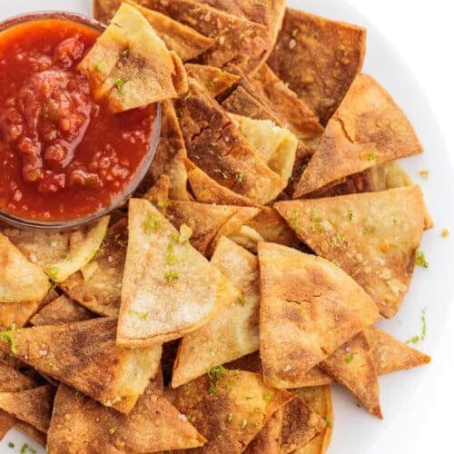 a plate of chips with salsa