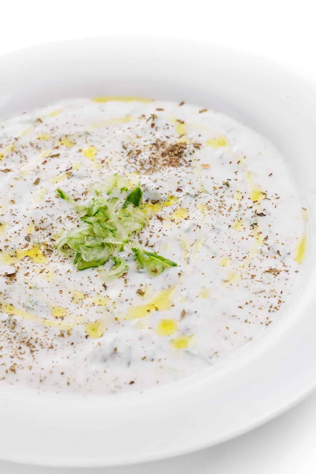 Chilled cucumber yogurt soup topped with mint and olive oil.