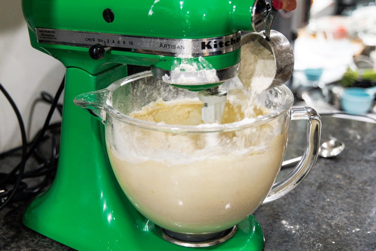Adding dry ingredients to shortbread dough.
