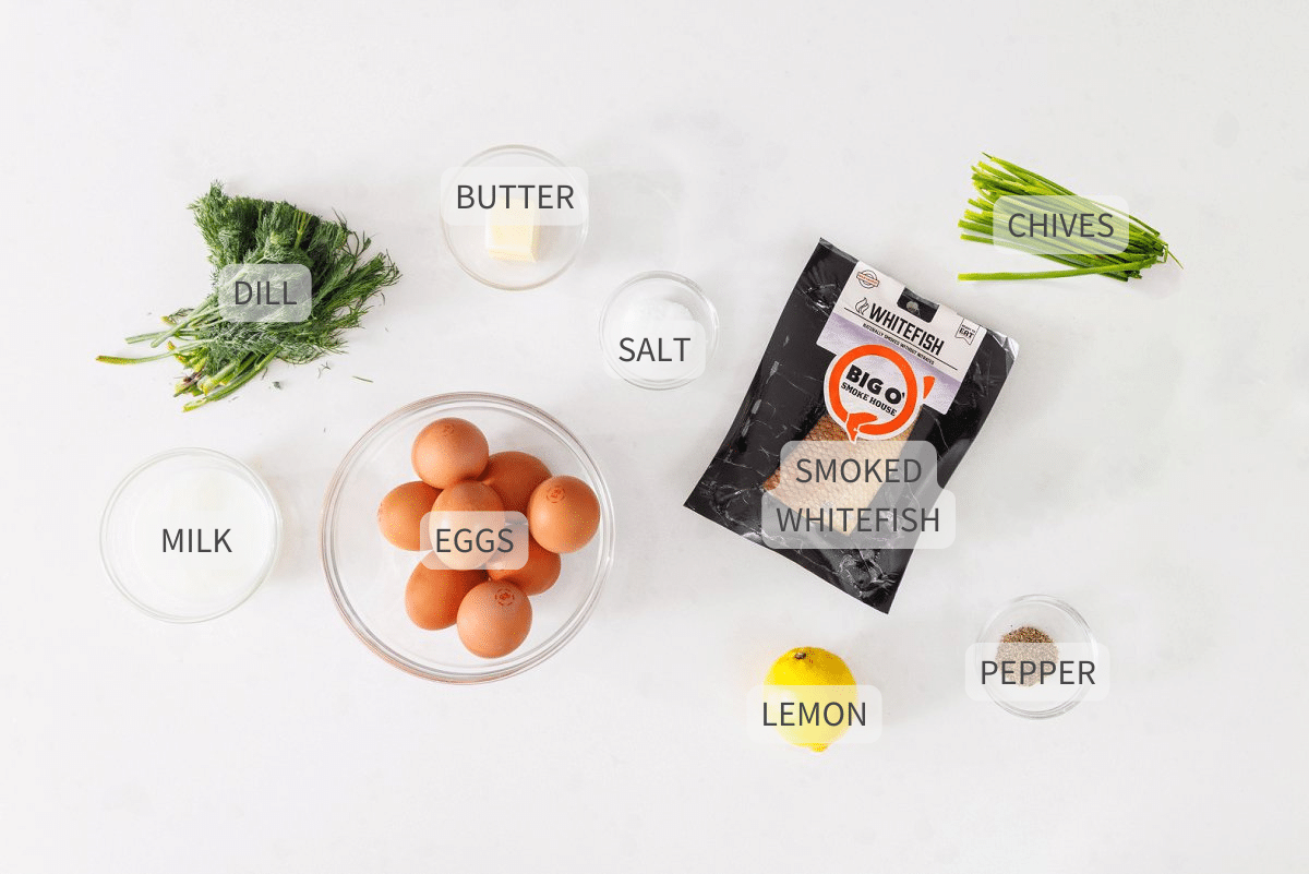 Labeled ingredients for smoked whitefish egg scramble on a white counter.