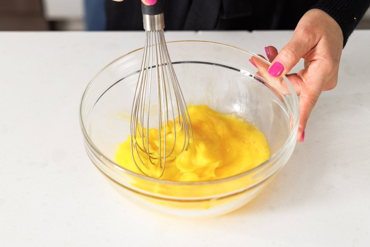 Whisking eggs in a bowl.