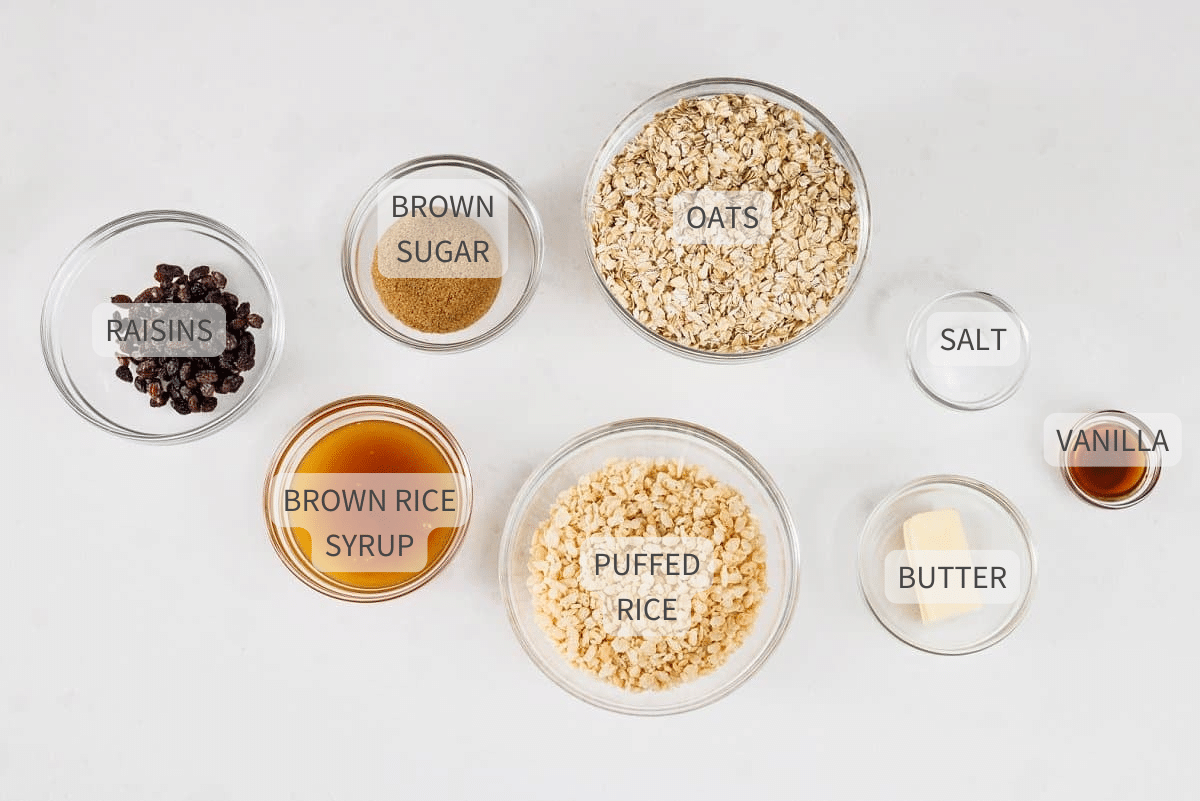 Labeled ingredients for chewy oatmeal raisin granola bars on a counter.