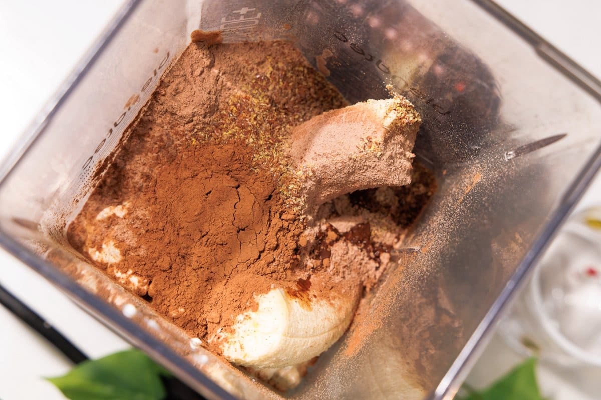 Ingredients for smoothie in a blender.