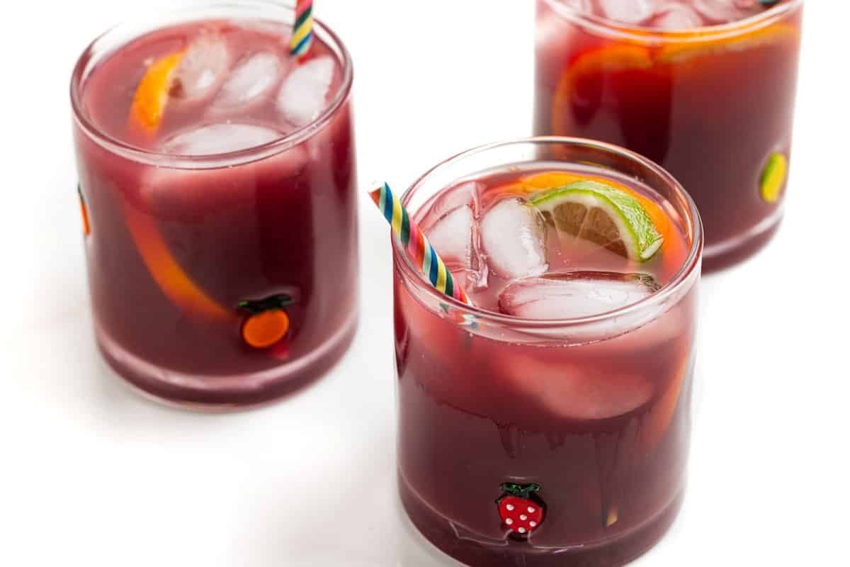 Three tumblers of 5-ingredient sangria over ice.