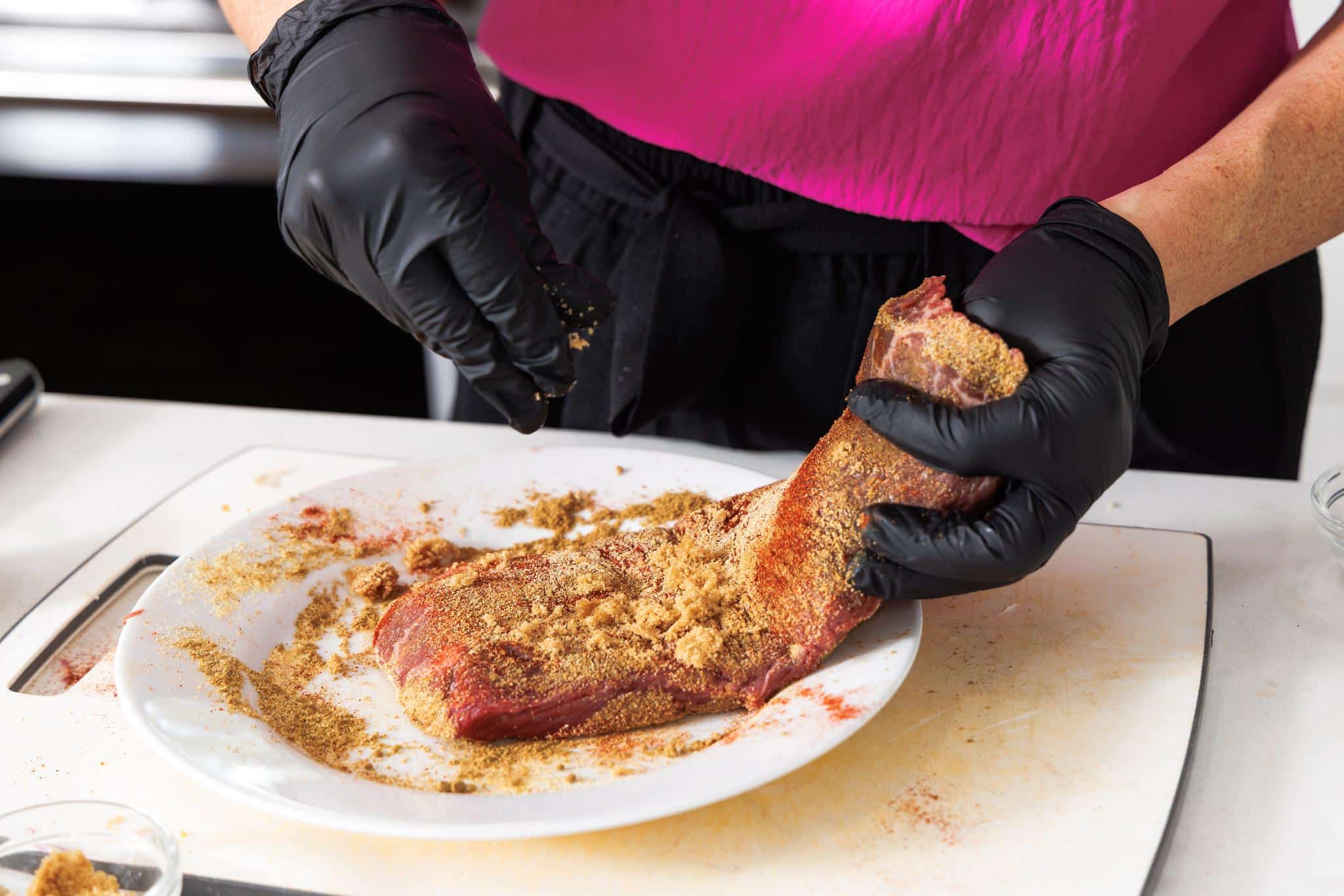 Seasoning flank steak.