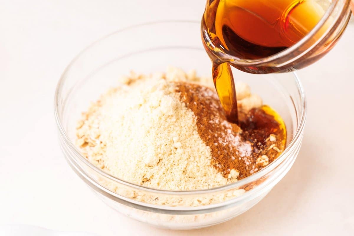 Pouring maple syrup to bowl.