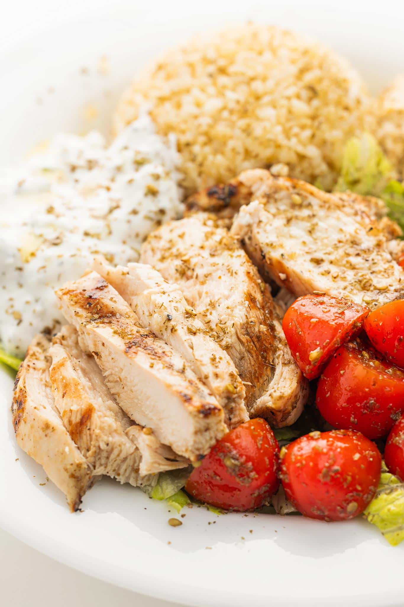 Lebanese tawook chicken bowl garnished with za'atar.