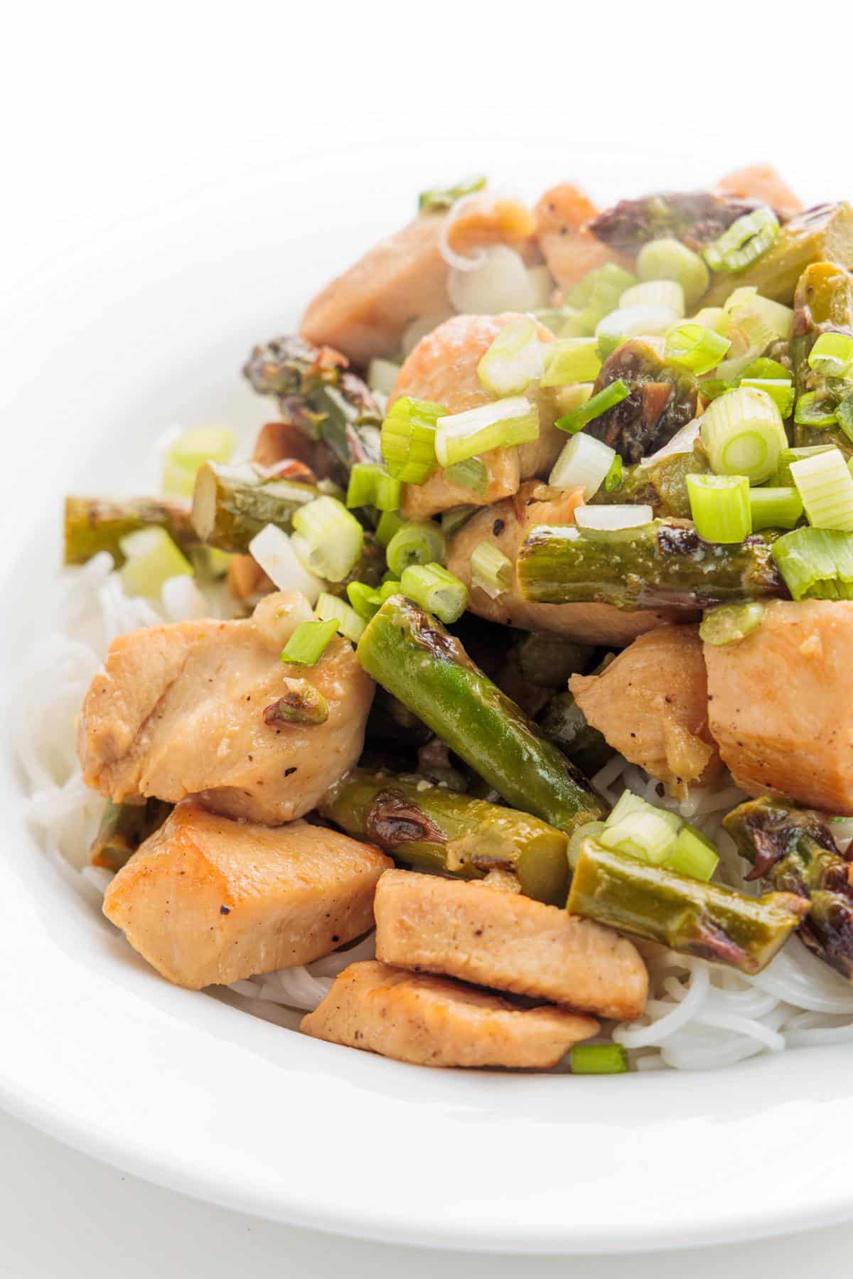 Thai green curry chicken with asparagus over a bed of white rice.