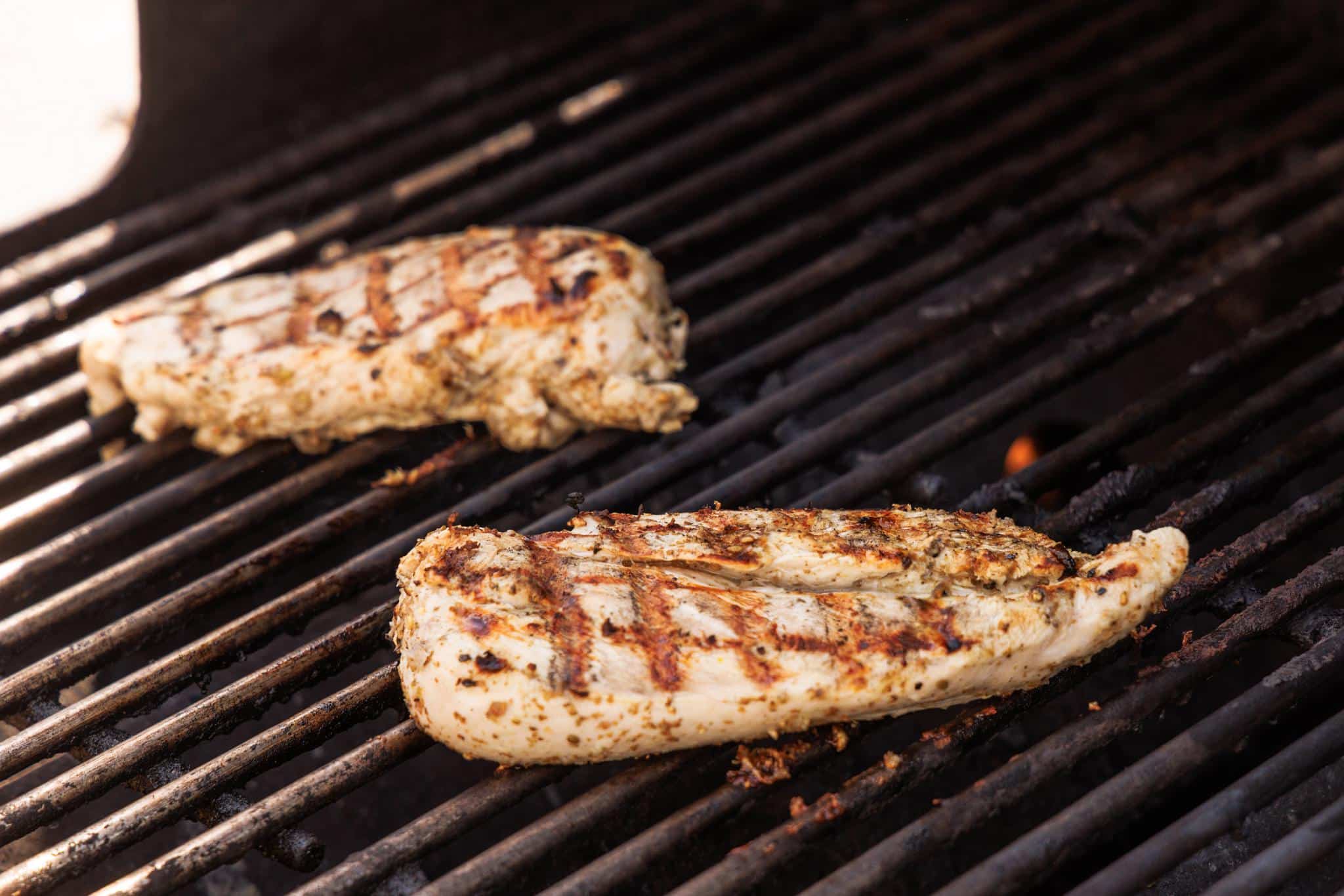 Tawook chicken cooking on the grill.