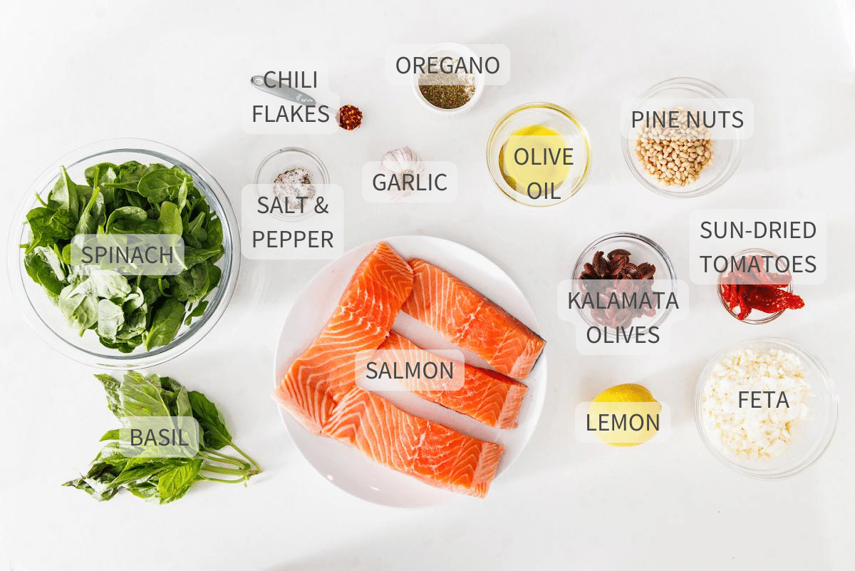 Labeled ingredients for stuffed salmon with spinach, olives, and feta.