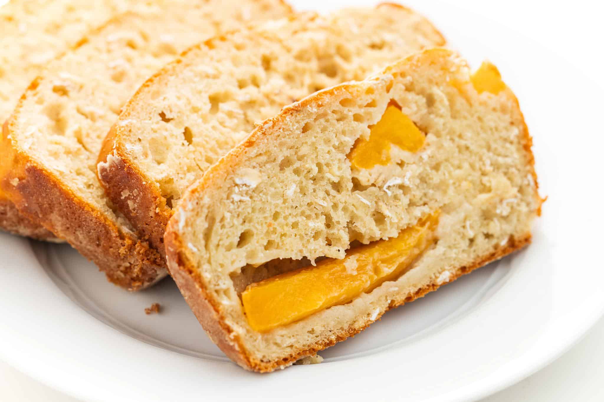 Slices  of peach oatmeal bread.
