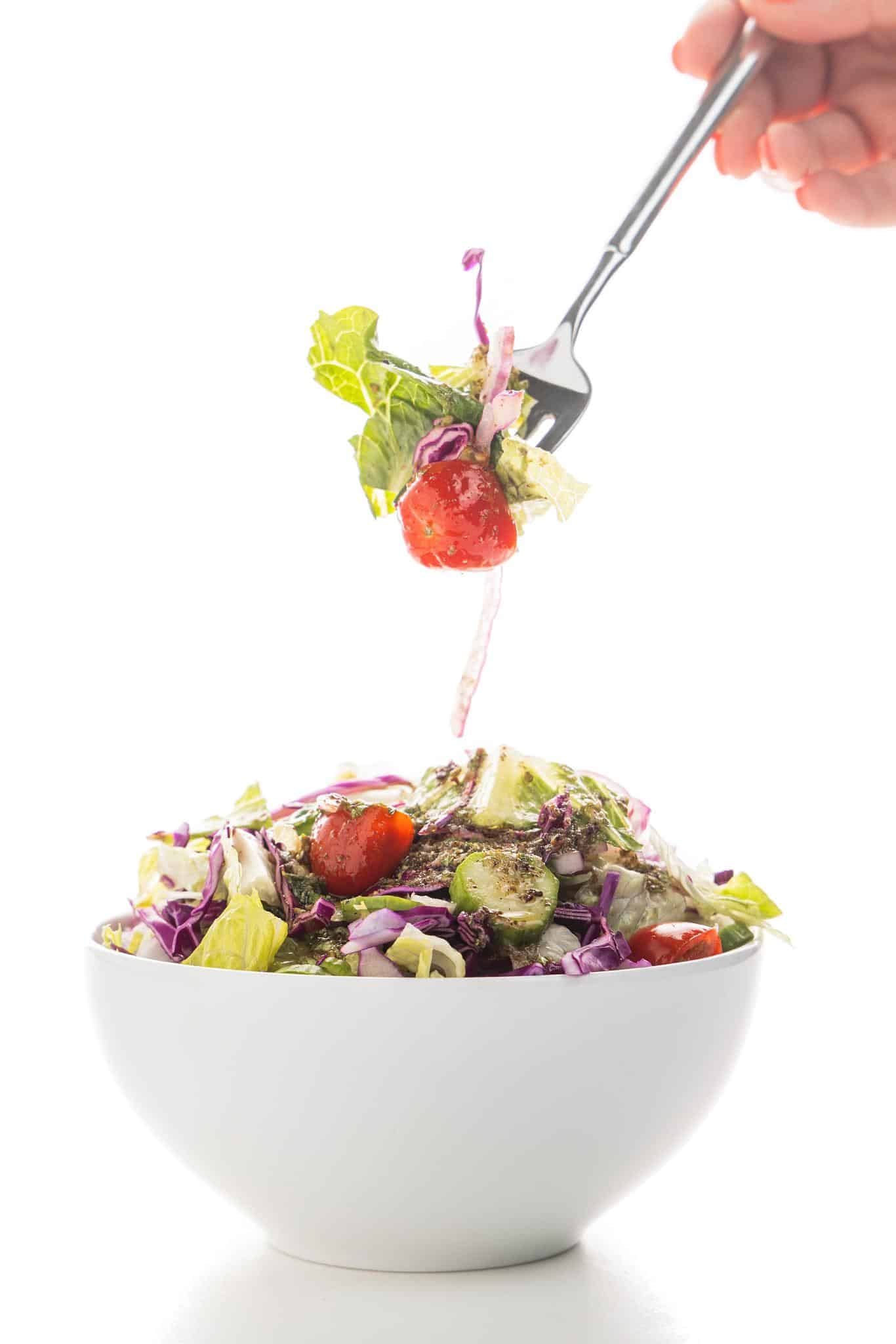 A forkful of salad dressed in Lebanese Salad dressing.
