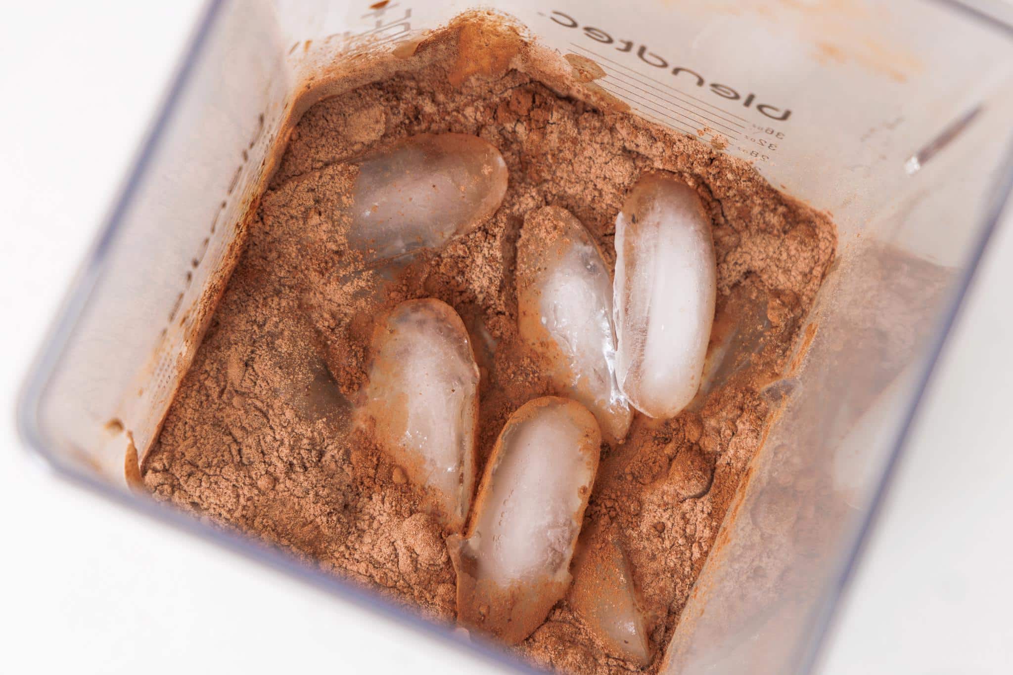 Ice added to blender and cocoa powder.