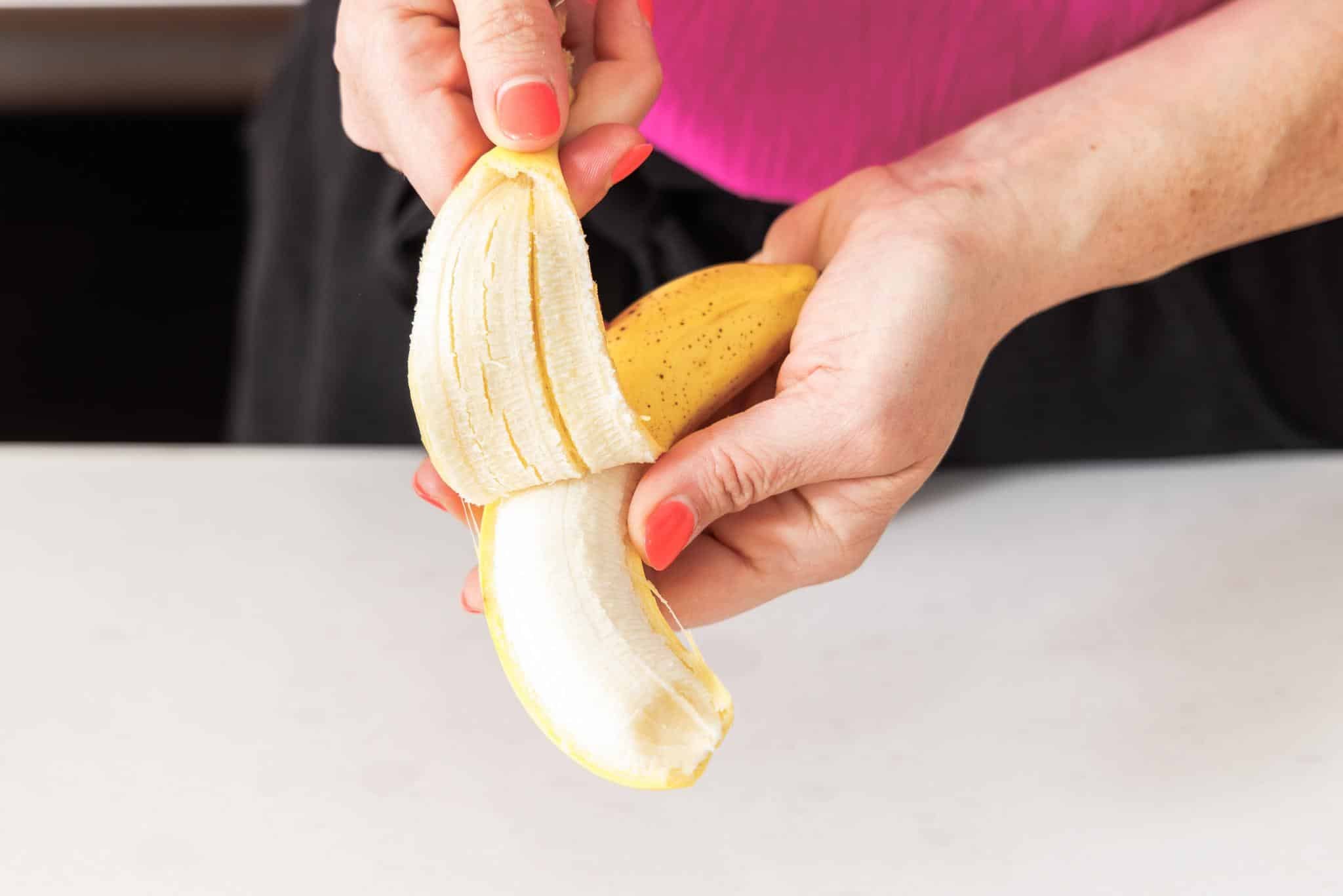 Liz peeling a banana.